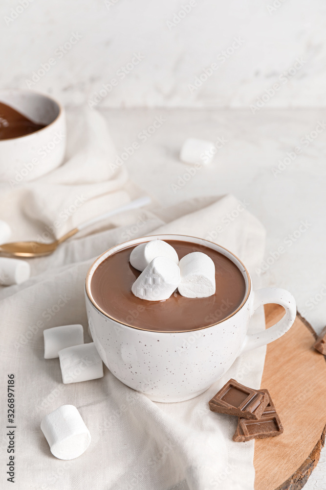 Cup of hot chocolate on table