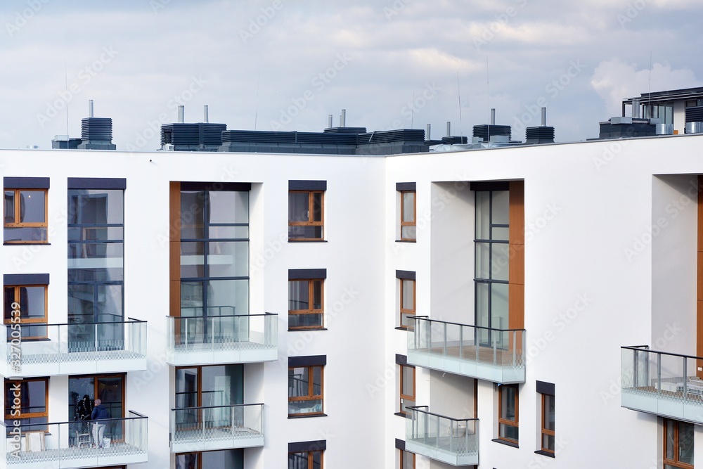 Contemporary residential building exterior in the daylight. Modern apartment buildings on a sunny da