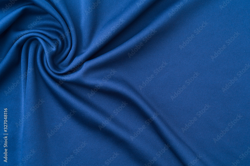 Crumpled knitted dark blue fabric. Abstract wrinkled cloth background