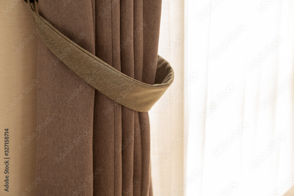 soft brown curtain with morning light from window bedroom background