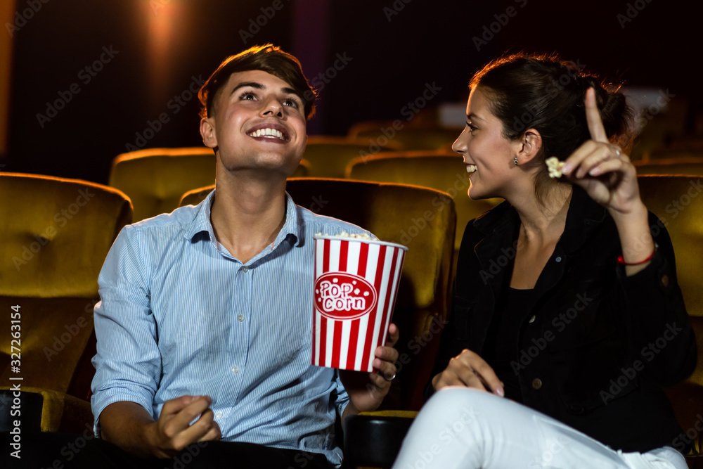 People audience watching movie in the movie theater cinema. Group recreation activity and entertainm