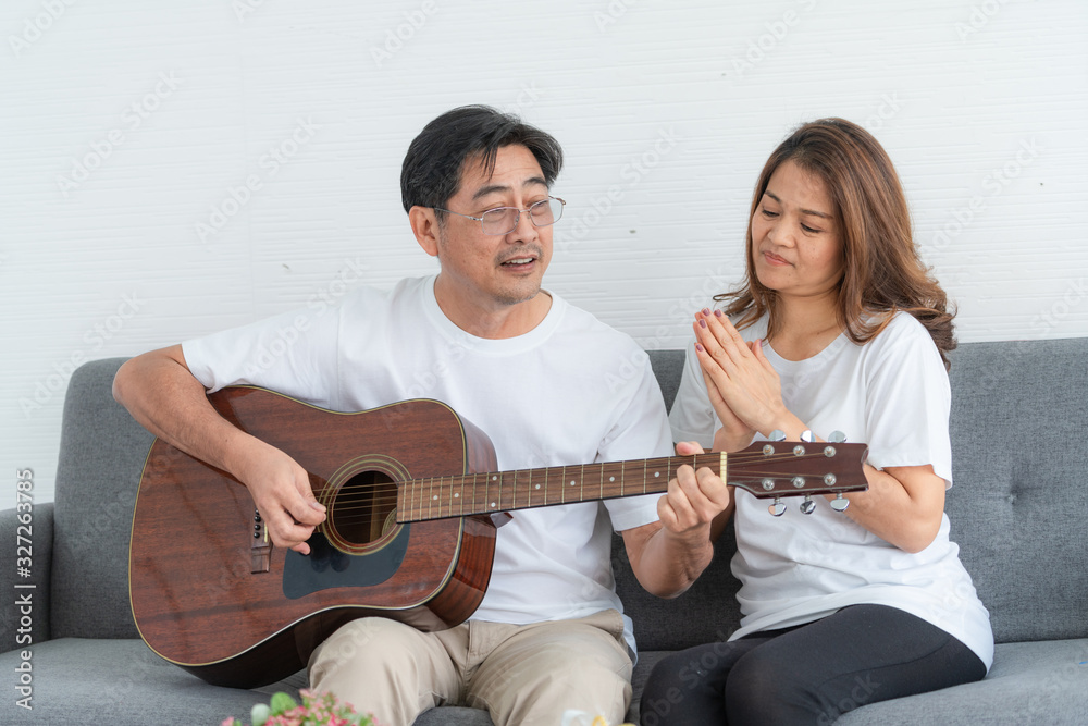 Happy Asian senior couple having good time at home. Old people retirement and healthy citizens elder