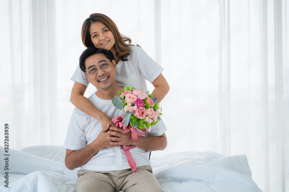 Happy Asian senior couple having good time at home. Old people retirement and healthy citizens elder