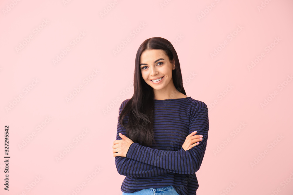 Beautiful young woman on color background