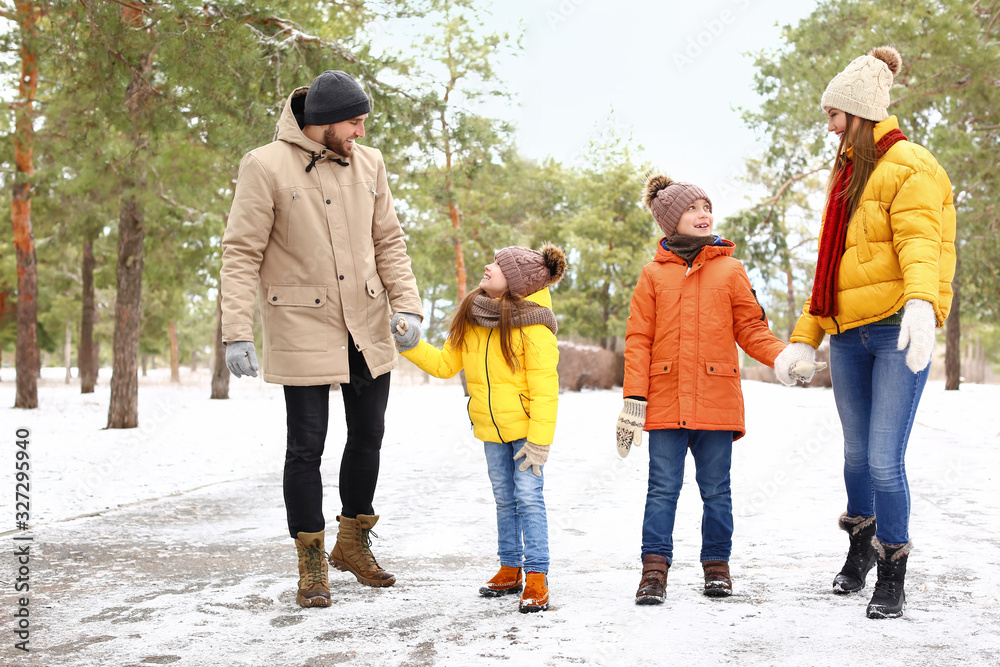 Happy family in park on winter day