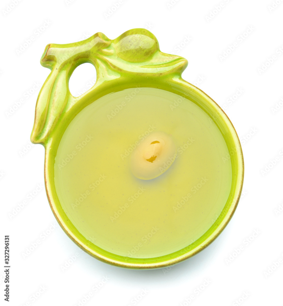 Bowl of tasty olive oil on white background