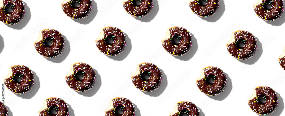 Chocolate glazed donuts overhead view flat lay