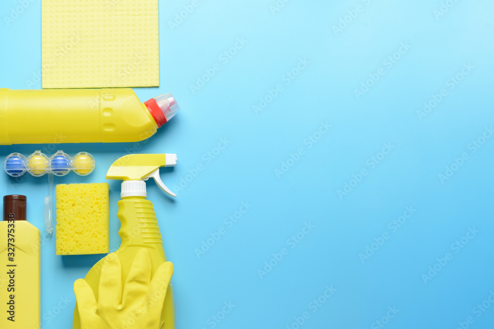 Set of cleaning supplies on color background