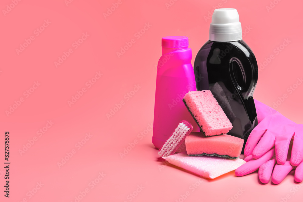 Set of cleaning supplies on color background