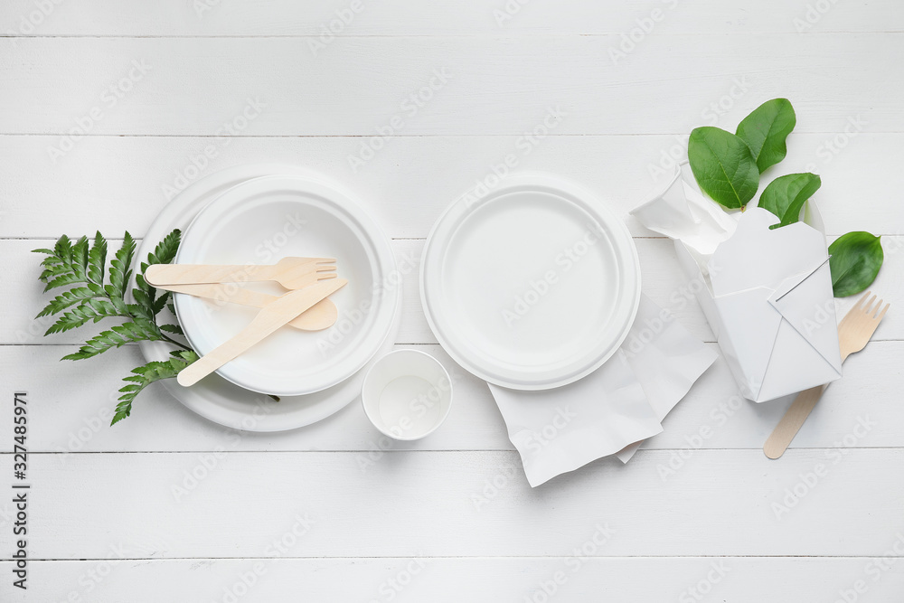 Different garbage on white wooden background. Recycling concept