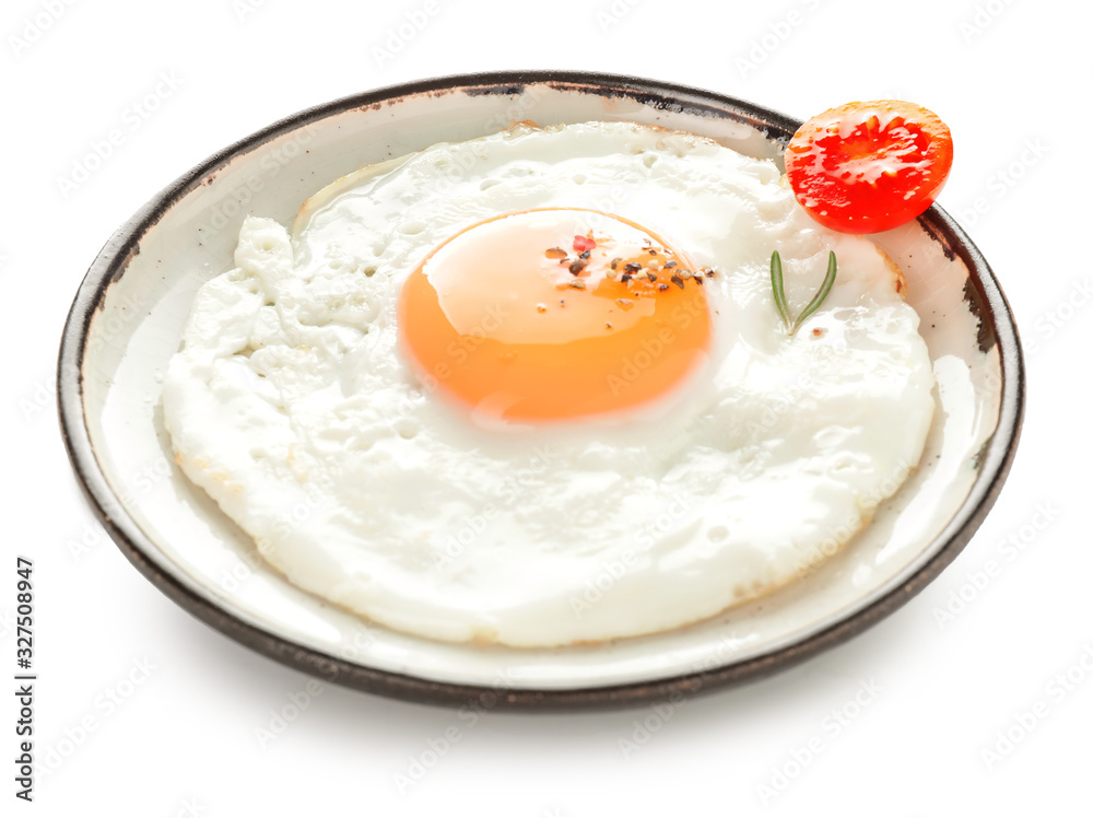 Plate with fried egg on white background