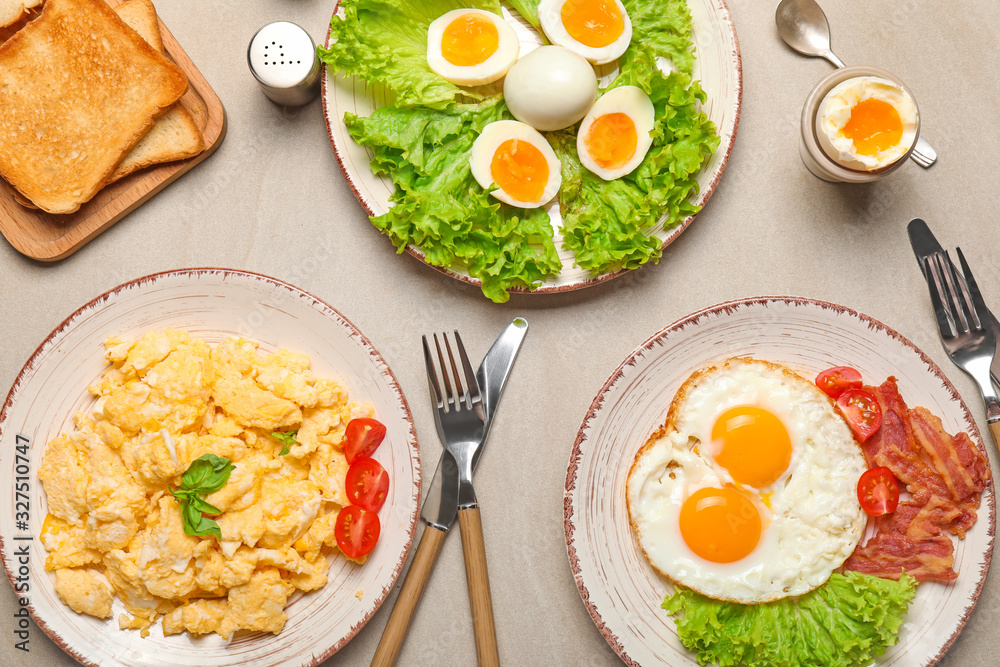 Different tasty dishes with eggs on table