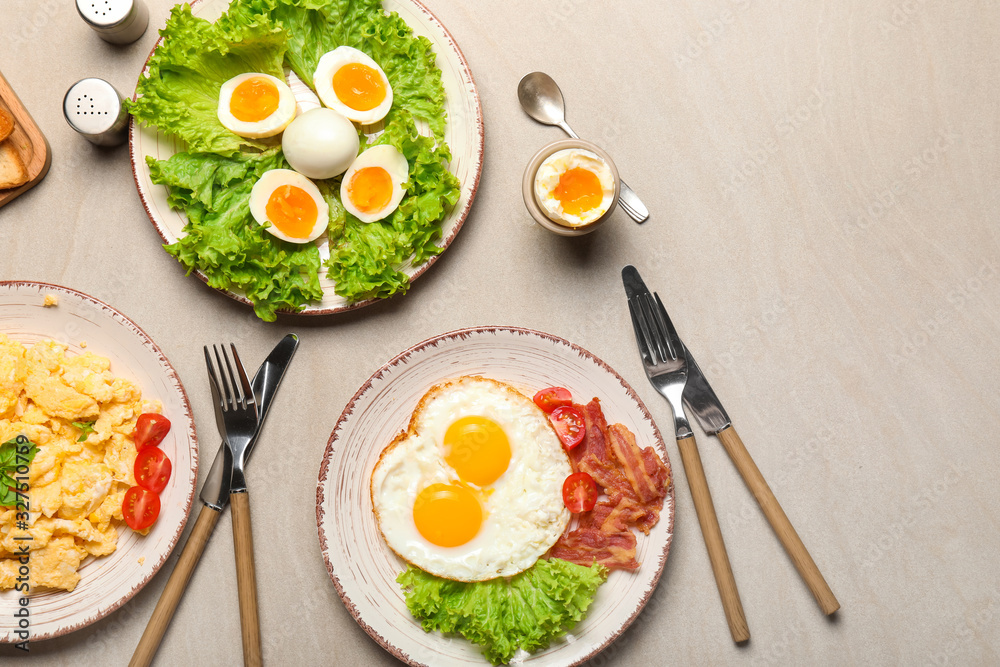 Different tasty dishes with eggs on table