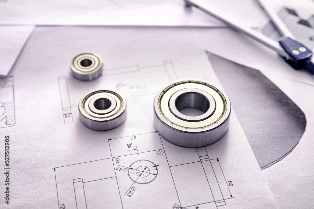 Bearings and drawings on table of engineer