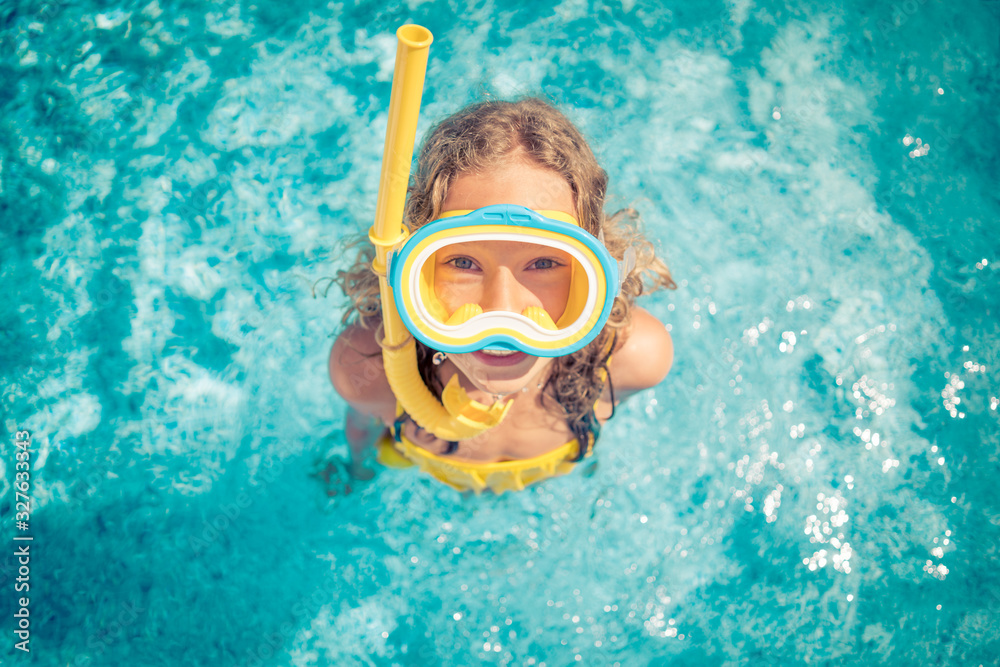 Happy child in swimming pool