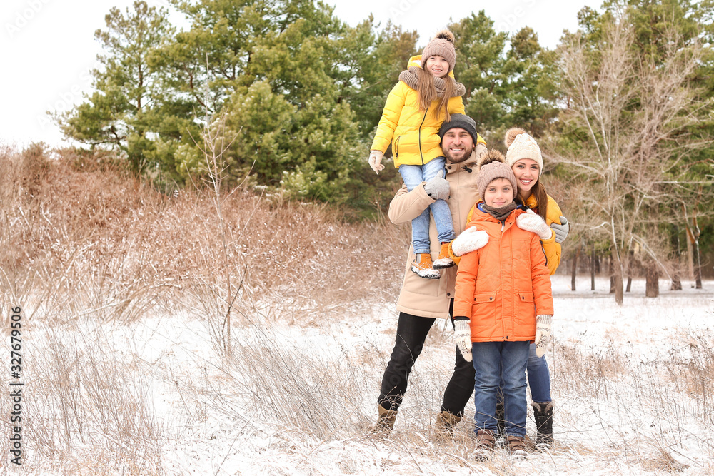 Happy family in park on winter day