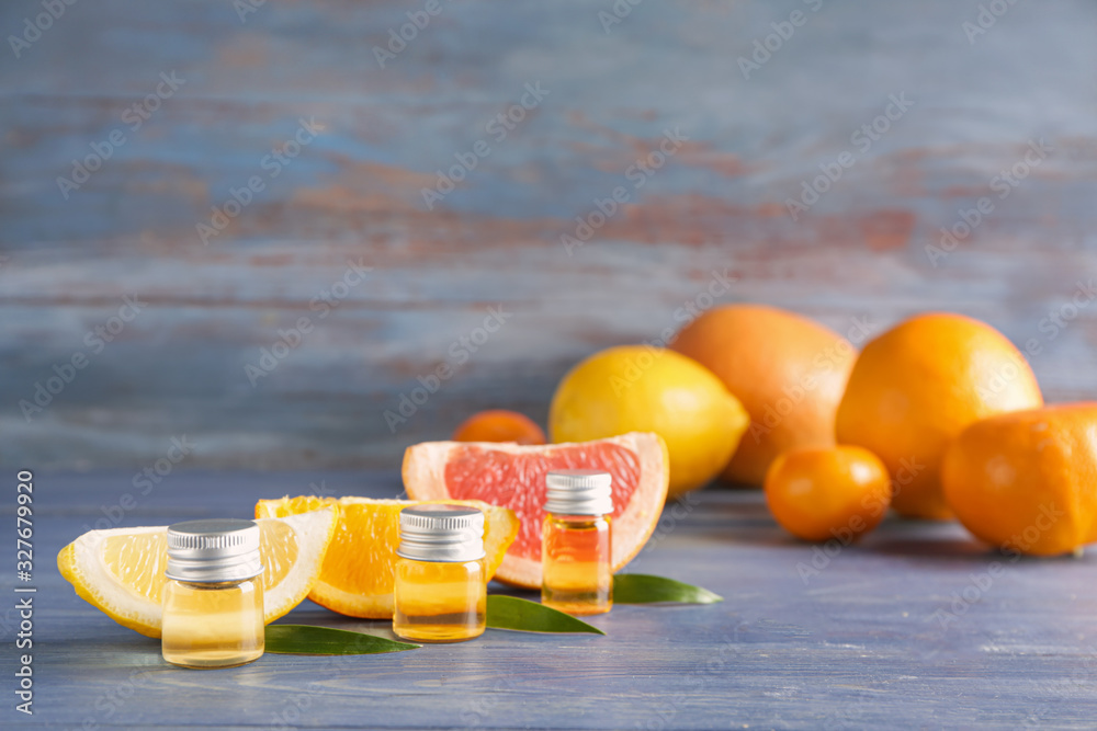 Bottles of citrus essential oils on table