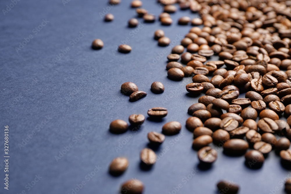 Many coffee beans on dark background