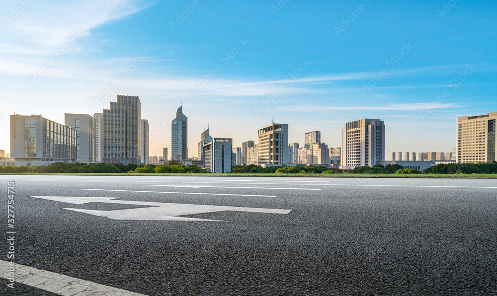 Asphalt road and urban architectural landscape of Ningbo..