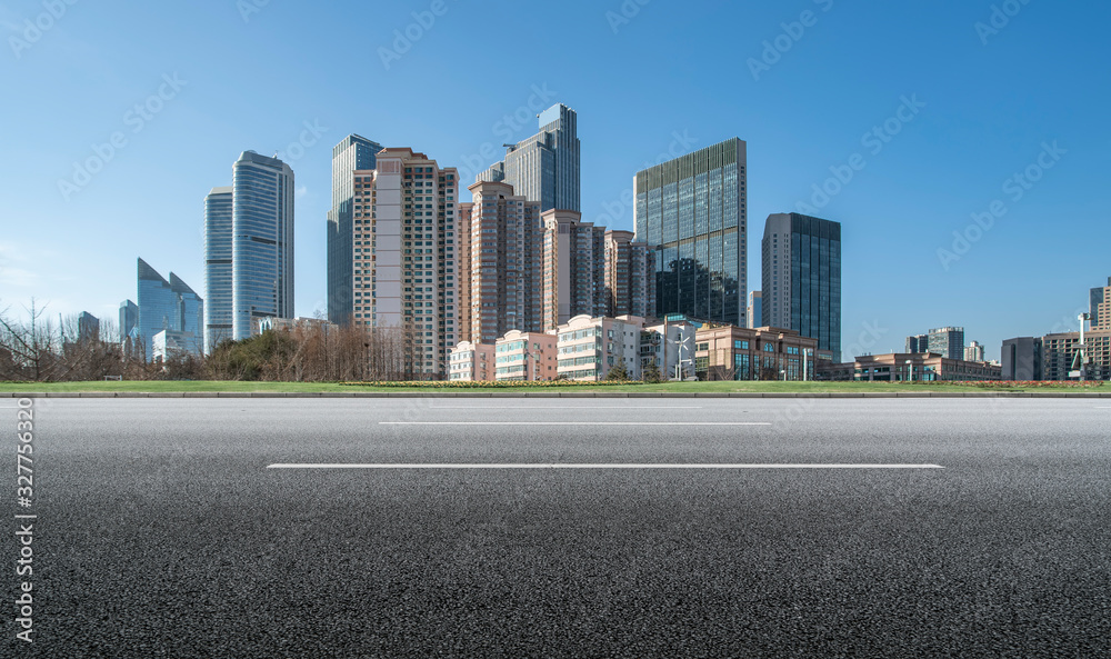 Qingdao urban skyline and asphalt road architectural landscape..