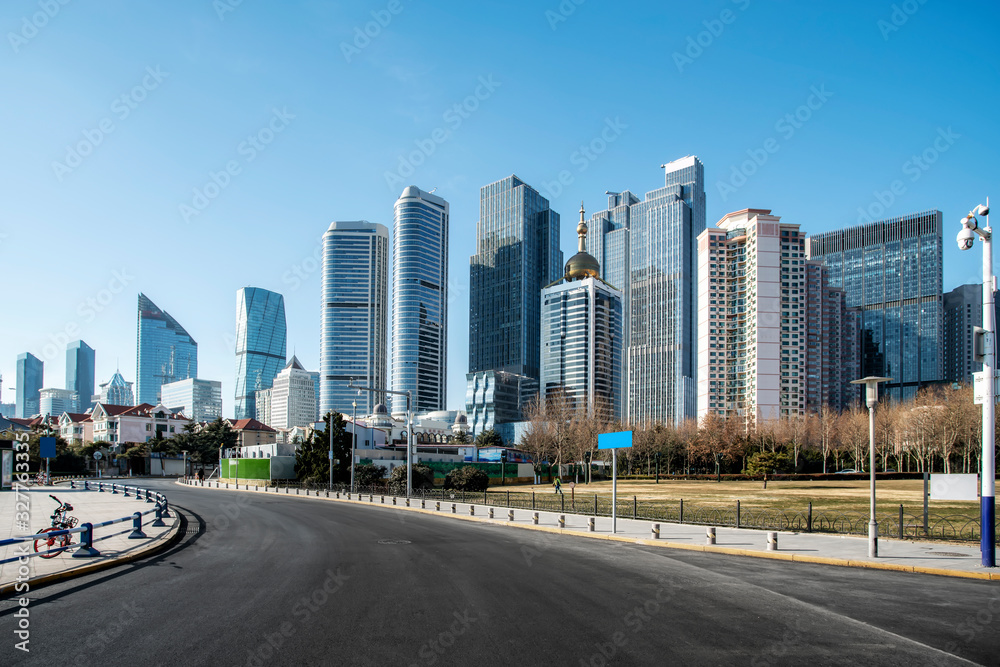 Qingdao urban skyline and asphalt road architectural landscape..