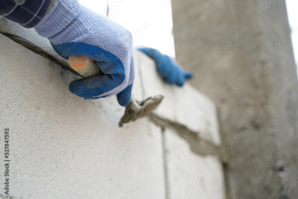 Close up of industrial cement installing cement on construction site.