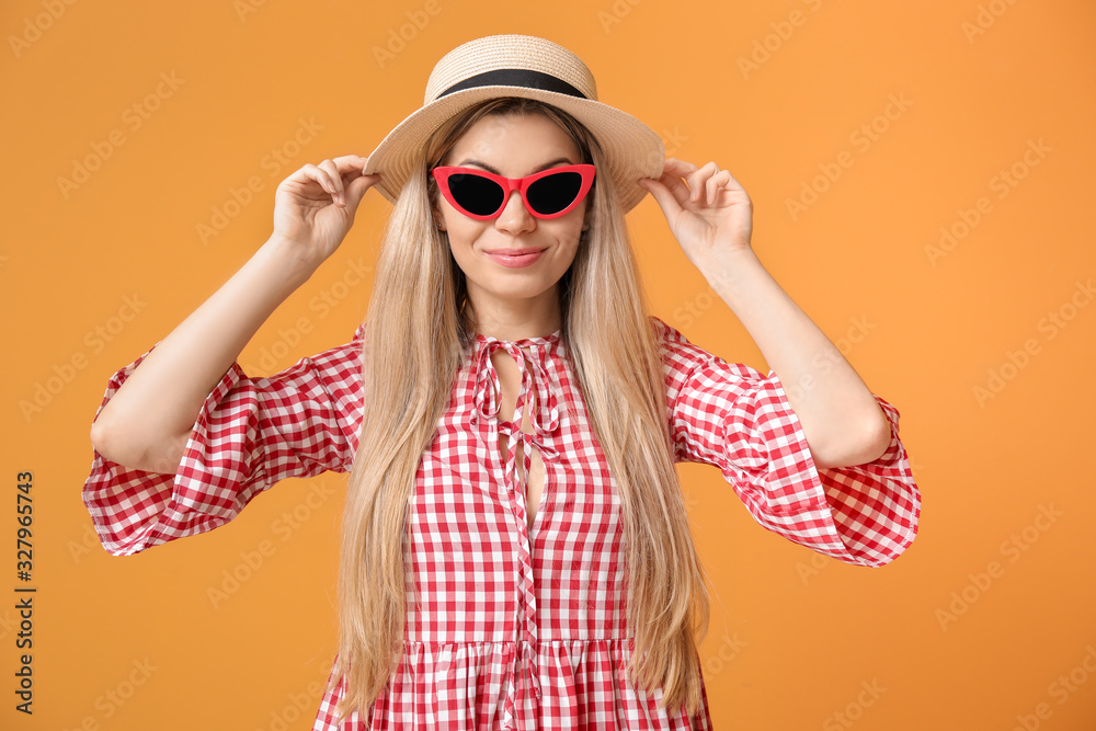 Beautiful young woman on color background