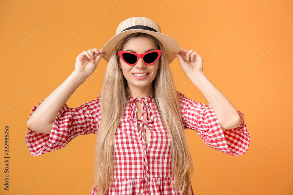 Beautiful young woman on color background