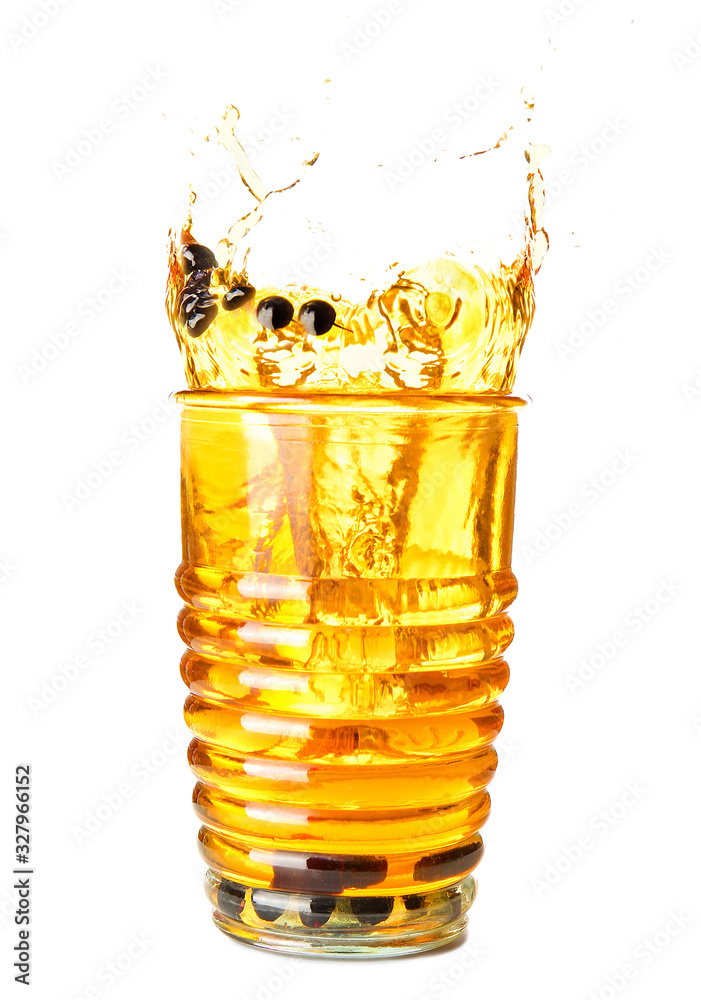 Glass of cold cocktail with splashes on white background