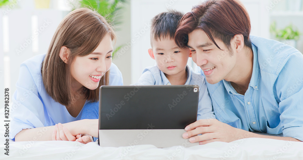 Parent play with child by tablet