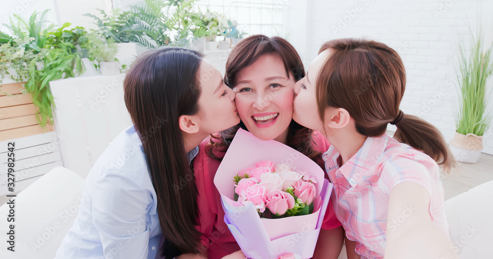 Daughters and mom take selfie