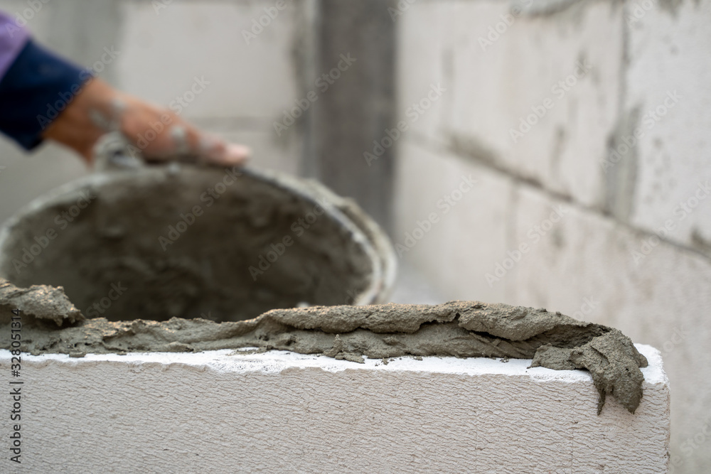 Close up of industrial cement installing cement on construction site.