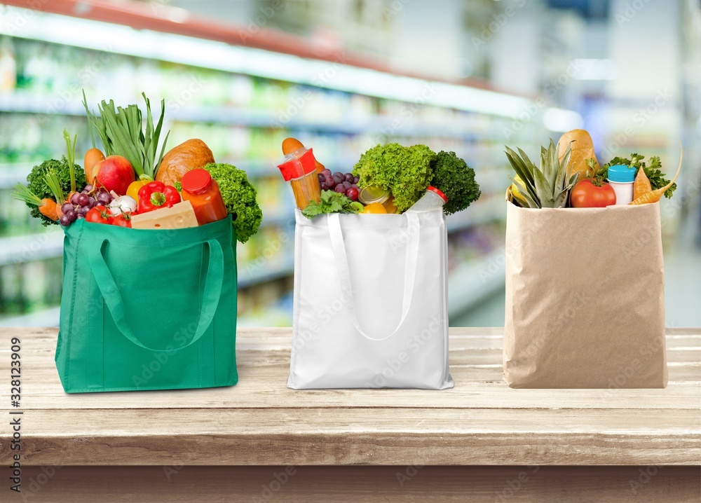 Full shopping bags with various vegetables