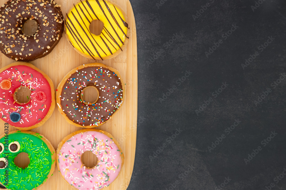 Dessert, Donuts, chocolate and strawberry circles, sugar and cream on Donuts and hot coffee cups, pr