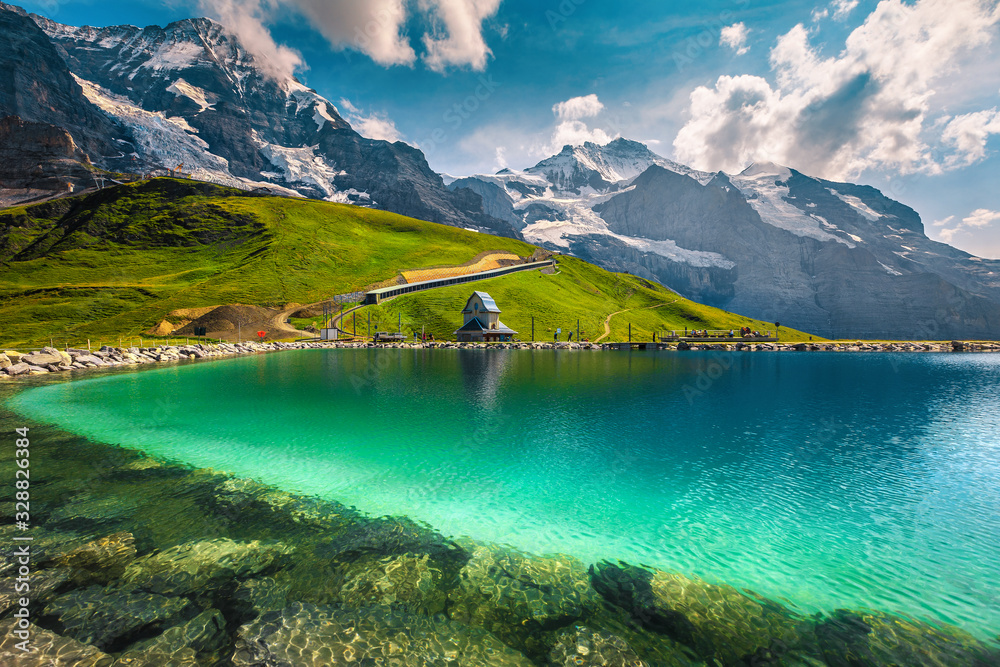 Turquoise lake and high mountains with glaciers, Bernese Oberland, Switzerland