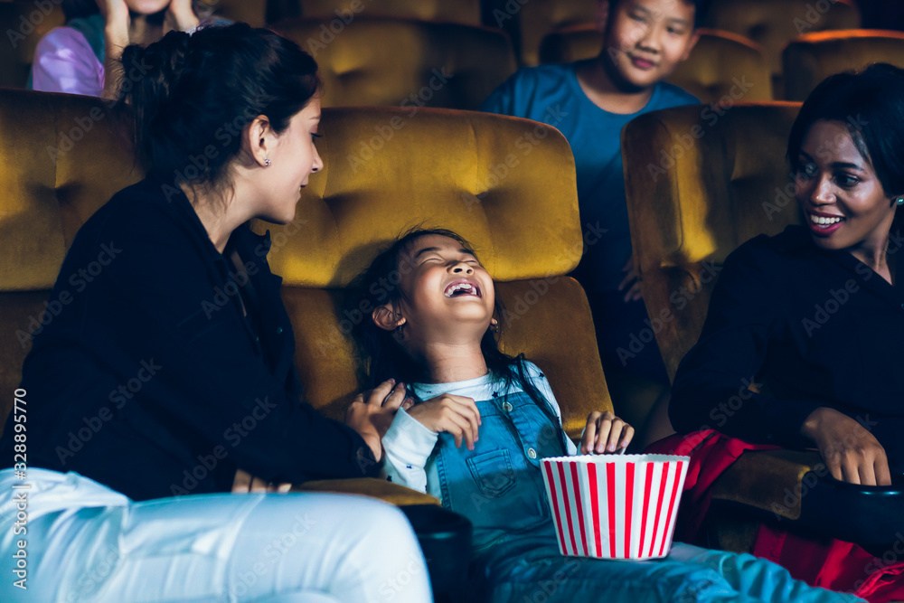 The girls cried loudly in the cinema, causing annoyance to the people sitting next to and behind the