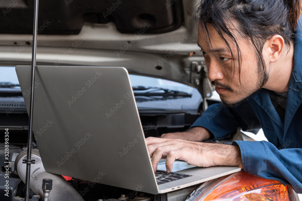 Professional mechanic providing car repair and maintenance service in auto garage. Car service busin