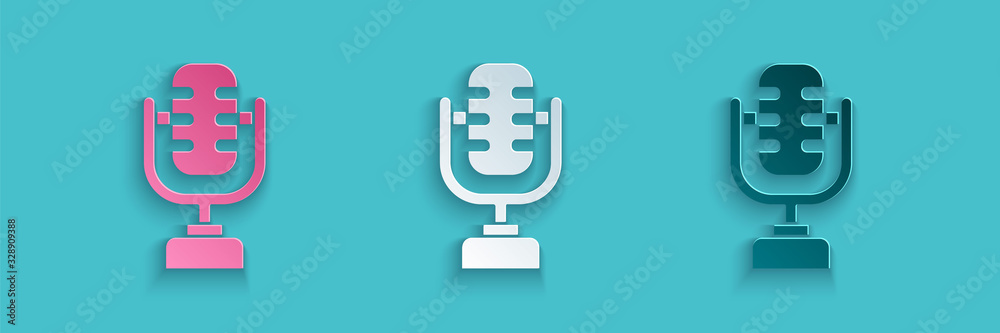 Paper cut Microphone icon isolated on blue background. On air radio mic microphone. Speaker sign. Pa