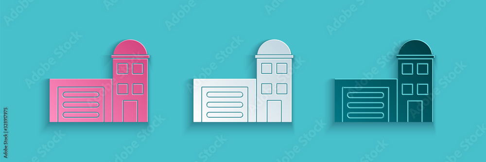 Paper cut Building of fire station icon isolated on blue background. Fire department building. Paper