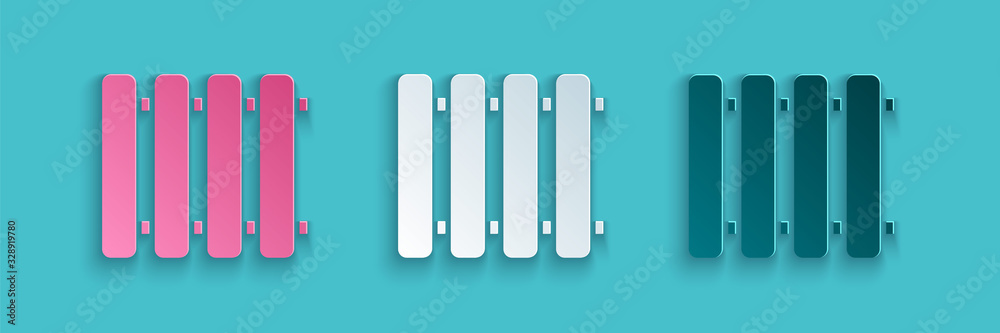 Paper cut Heating radiator icon isolated on blue background. Paper art style. Vector Illustration