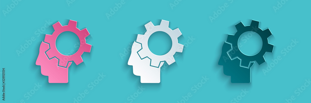 Paper cut Human head with gear inside icon isolated on blue background. Artificial intelligence. Thi