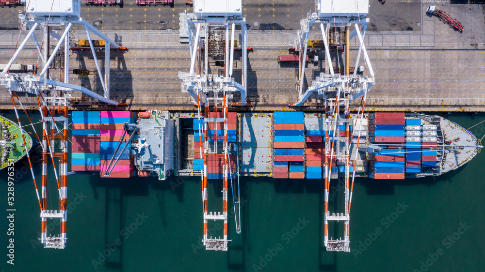 Aerial view container cargo ship freight shipping unloading at original destination port with quay c