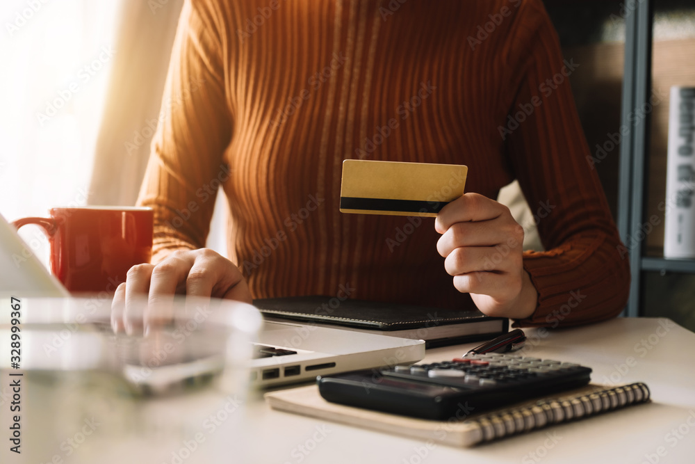 Business woman hands using smartphone and holding credit card with digital layer effect diagram as O