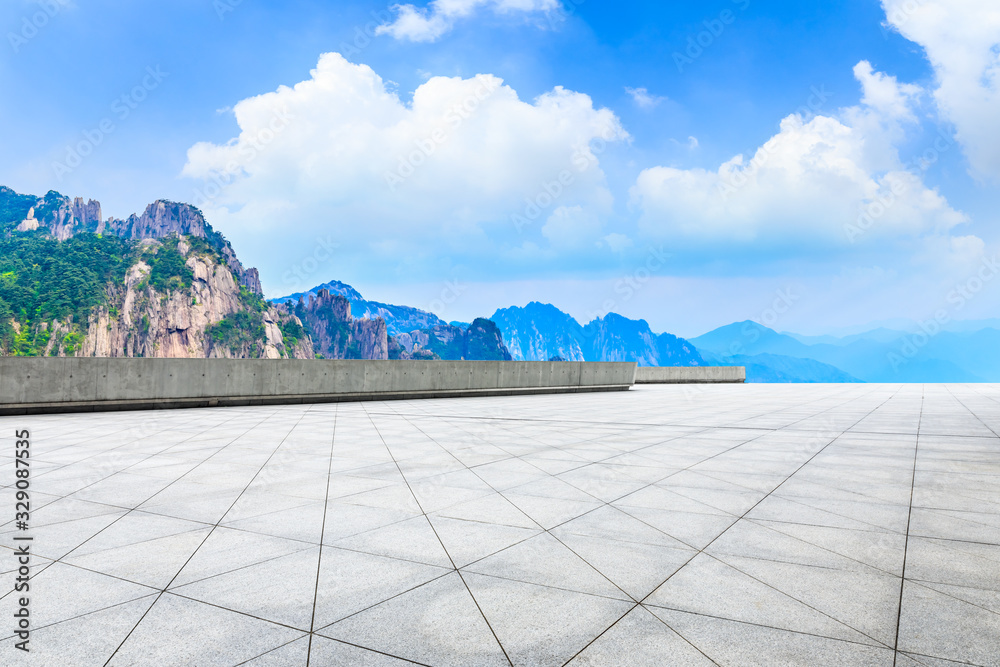 Empty square floor and green mountain with beautiful clouds.