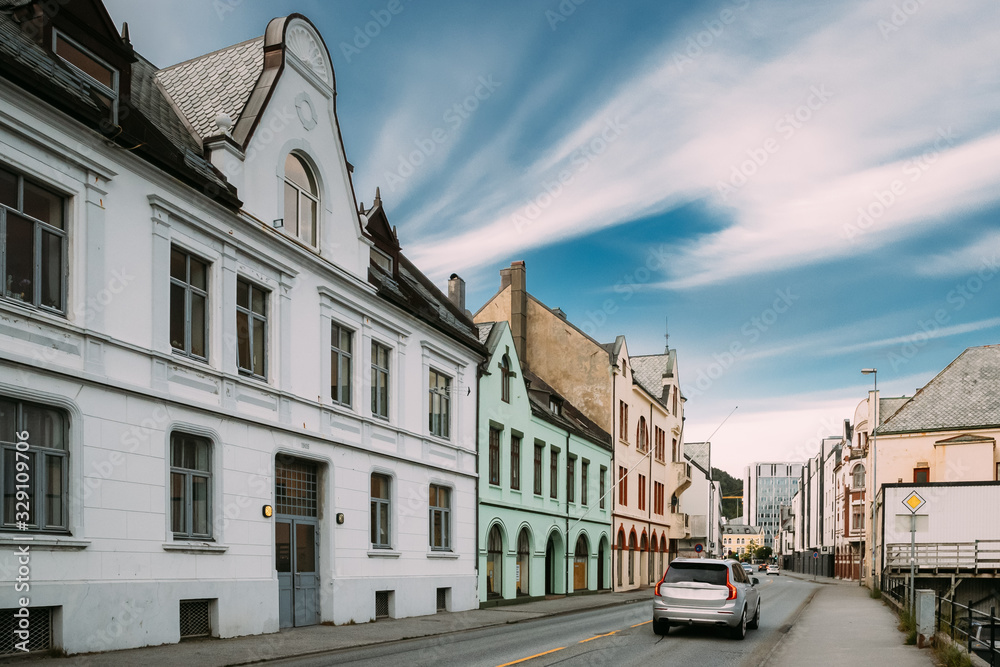 Alesund, Norway. Old Wooden Houses In Cloudy Summer Day