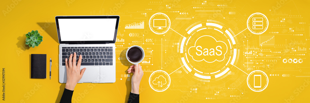 SaaS - software as a service concept with person using a laptop computer