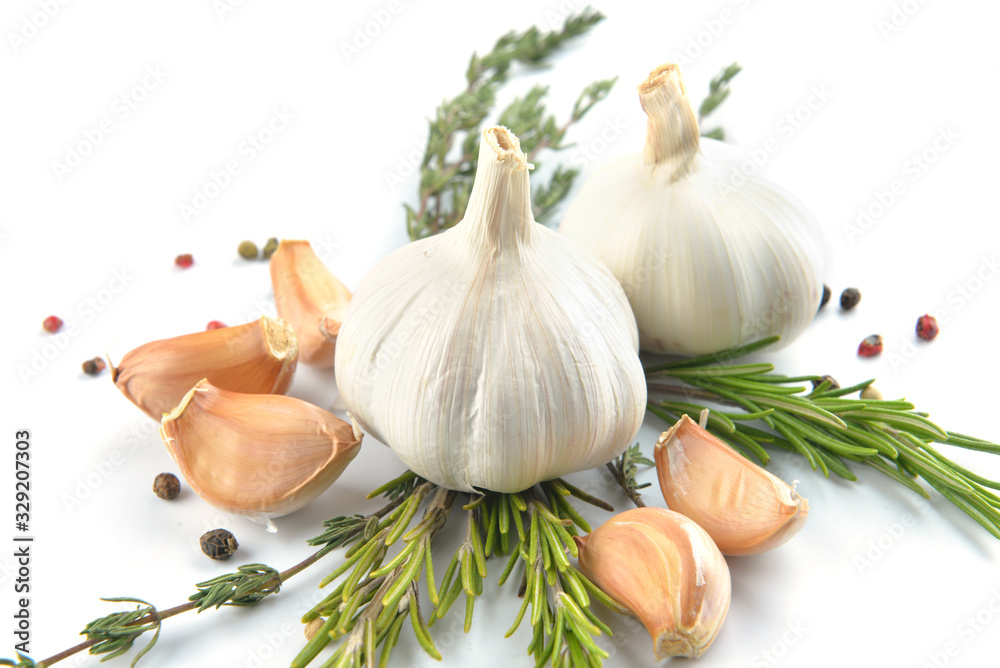 Fresh garlic with spices on white background