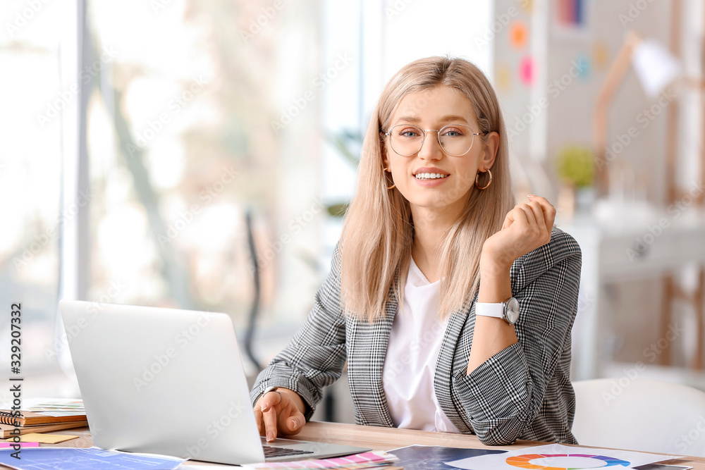 Female interior designer working in office