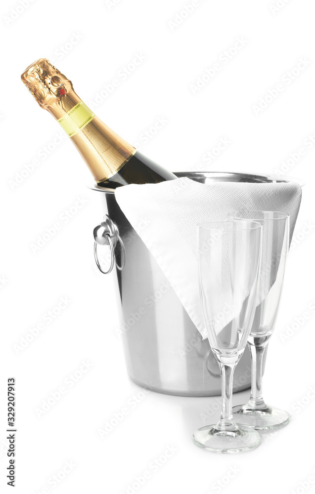 Bucket with bottle of champagne and glasses on white background