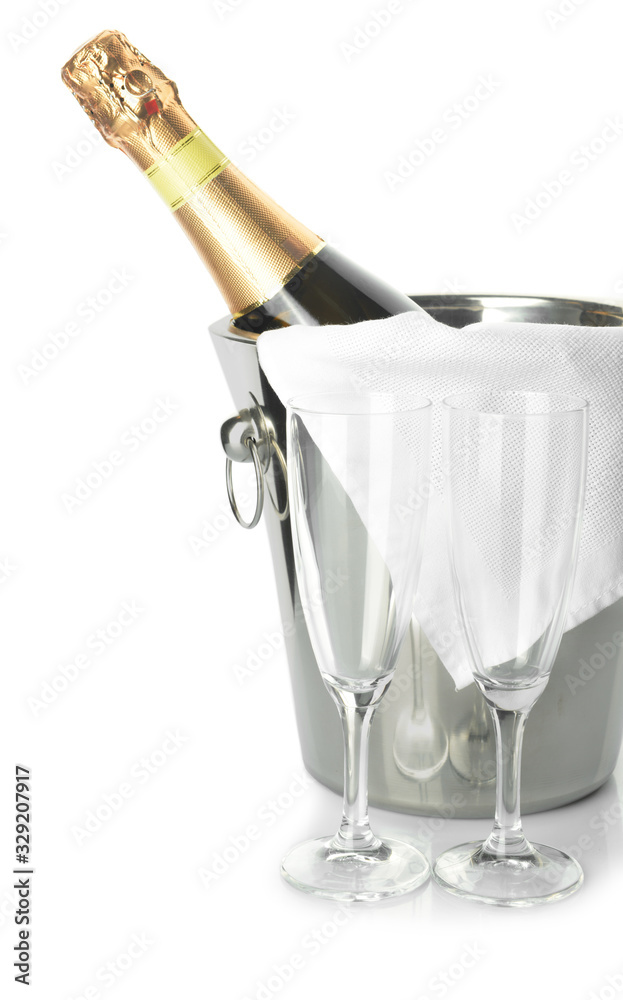 Bucket with bottle of champagne and glasses on white background